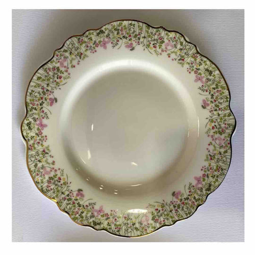 piatto in ceramica con fiorellini e bordo dorato