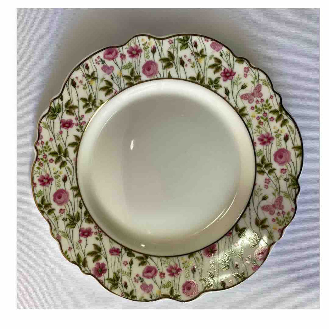 piatto in ceramica con fiorellini e bordo dorato